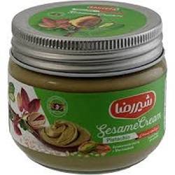 شیر رضا کرم کنجد پسته ای شیشه 200گ